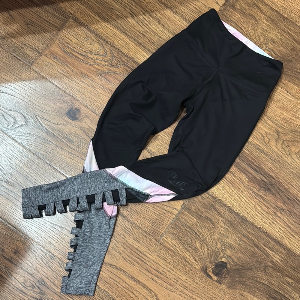 Pink Victoria’s Secret workout pants with netting and braiding down the bottom